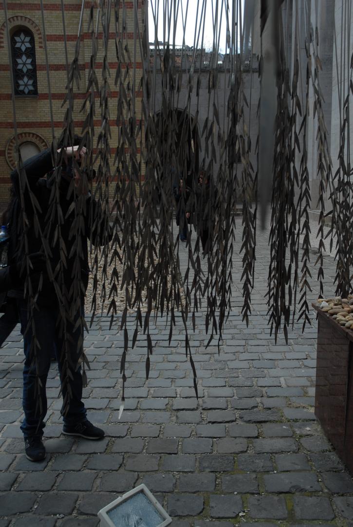 willow branches of the memorial/on each leaf the name of one of the murdered is engraved