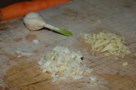 garlic and ginger, preparation for the wok; the spots on the cutting boards do distract, though garlic and ginger, preparation for the wok; the spots on the cutting boards do distract, though
