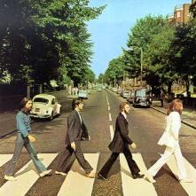    The white-suited John Lennon symbolised the preacher heading the/   funeral procession, while the bare-footed McCartney was the corpse./